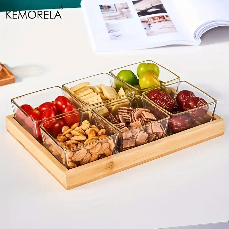 Clear glass square containers with gold-toned rims on a natural bamboo wooden rectangular tea tray set of 3 dining room