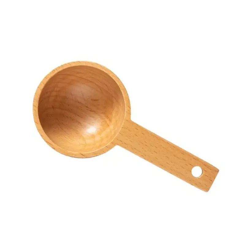 Light brown beech wood tablespoon coffee scoop with smooth rounded bowl and flat handle with hole in set of 5