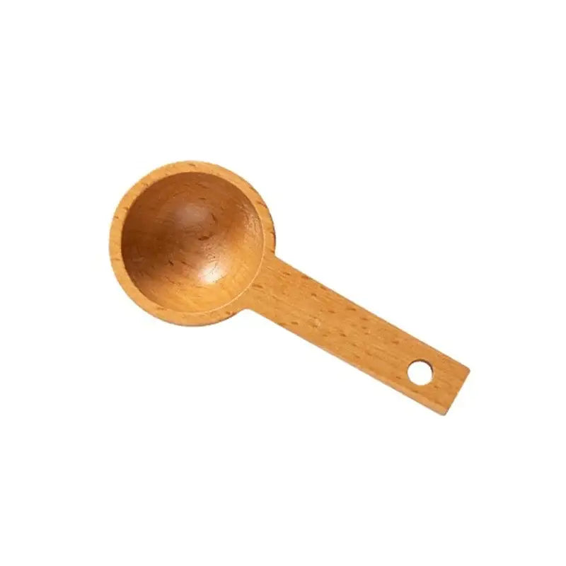 Light brown natural beech wood tablespoon coffee scoop with smooth rounded bowl and flat handle with hole end