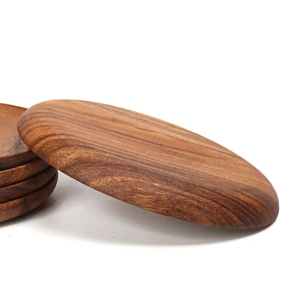 Natural beech wooden round plate with smooth oval shape rich brown finish and visible natural wood grain