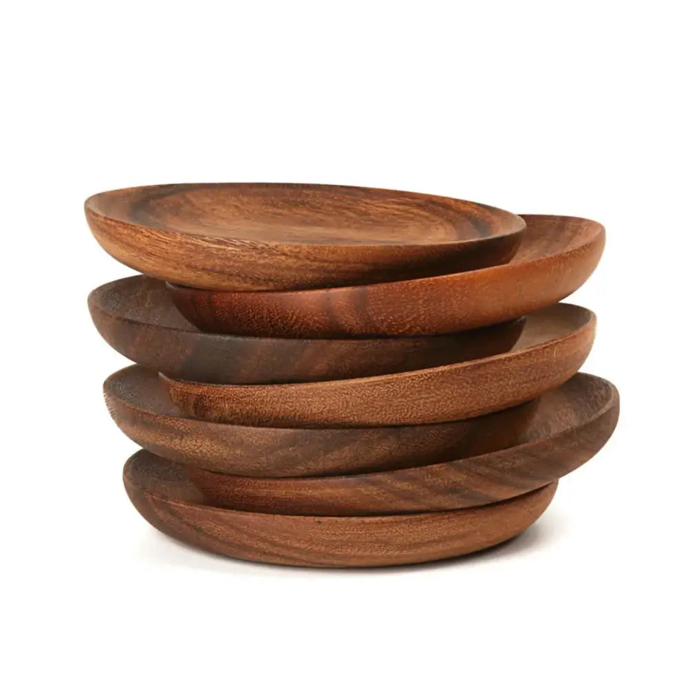 Stack of five rustic medium-brown natural beech wooden round plates with visible grain and slightly raised edges