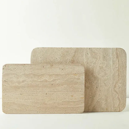 Beige travertine marble serving trays with natural textured surface and rounded edges for kitchen and bathroom decorbites marble plate