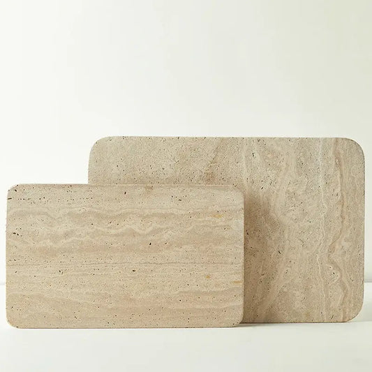 Beige travertine marble serving trays with natural textured surface and rounded edges for kitchen and bathroom decorbites marble plate