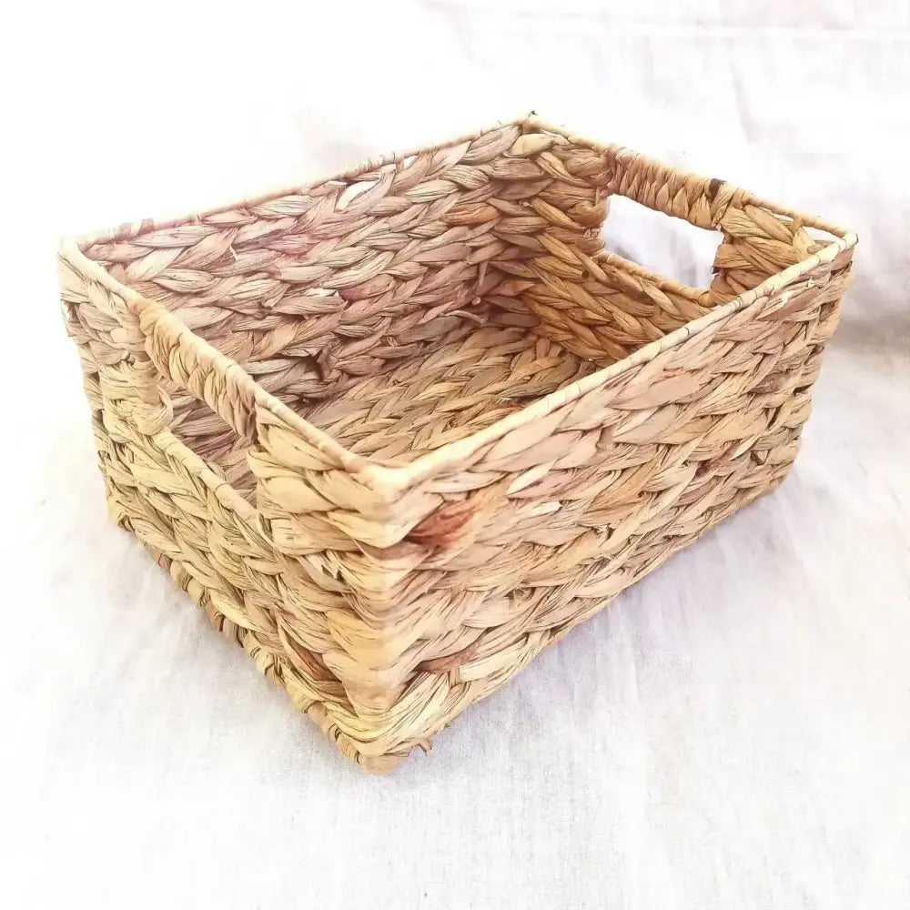 Natural brown woven rattan storage basket with braided seagrass design and handles by decorbites for office organization