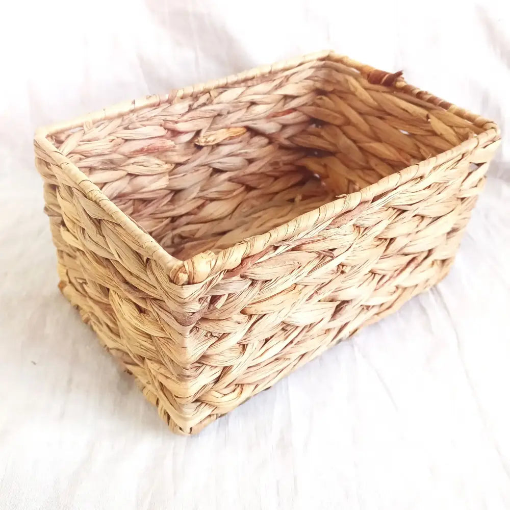 Rectangular woven rattan storage basket in natural brown and gray made of dried reed for office organizer by decorbites