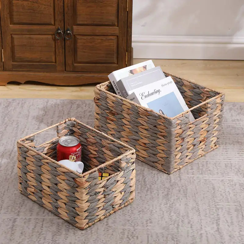 Two natural brown and gray woven rattan storage baskets with textured interlaced pattern by decorbites