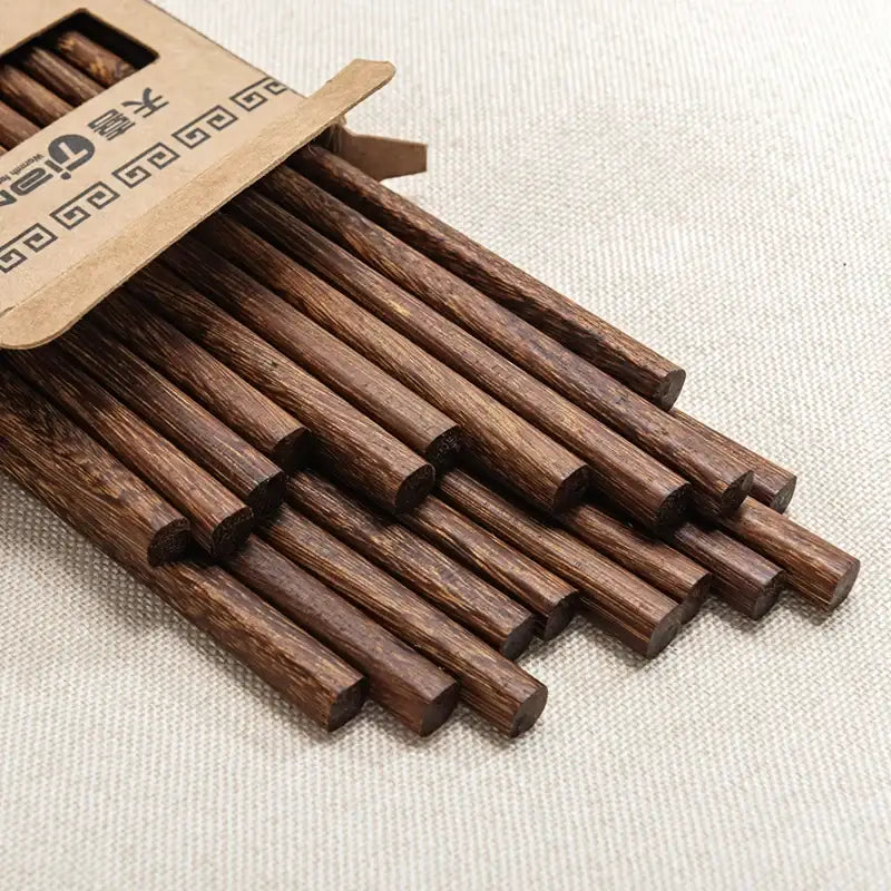Natural dark brown healthy wood chopsticks set with visible grain pattern in cardboard box for dining tableware decorbites healthy wood