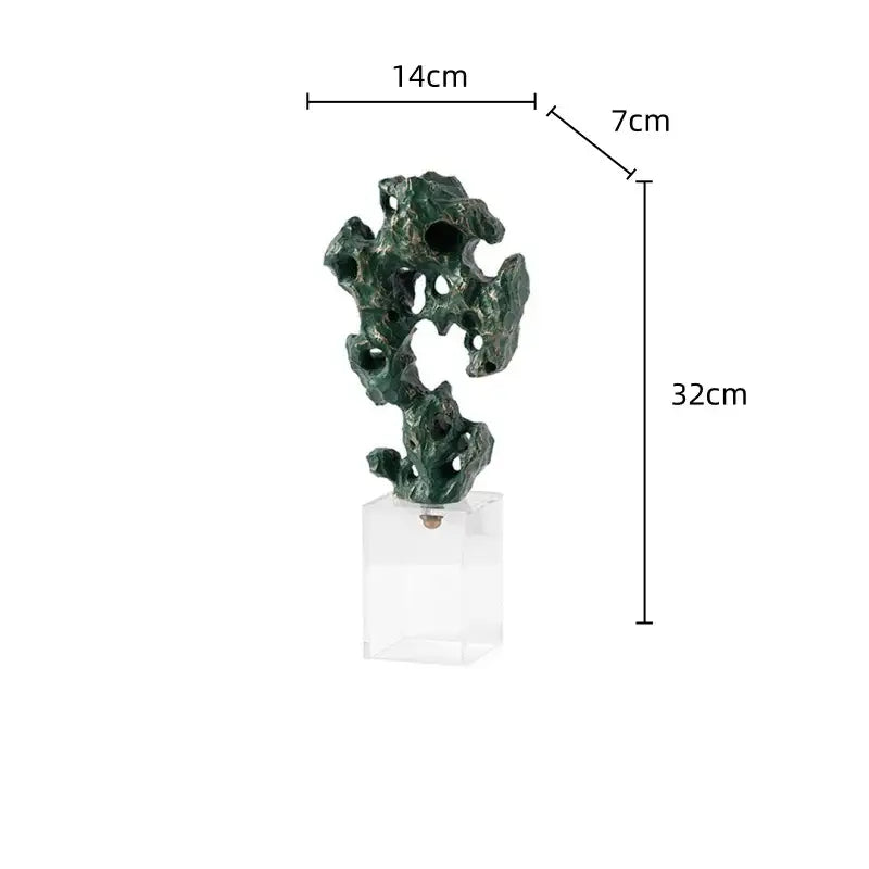 Dark green intricately carved green taihu stone coral sculpture with textured surface on clear acrylic base for living room decor