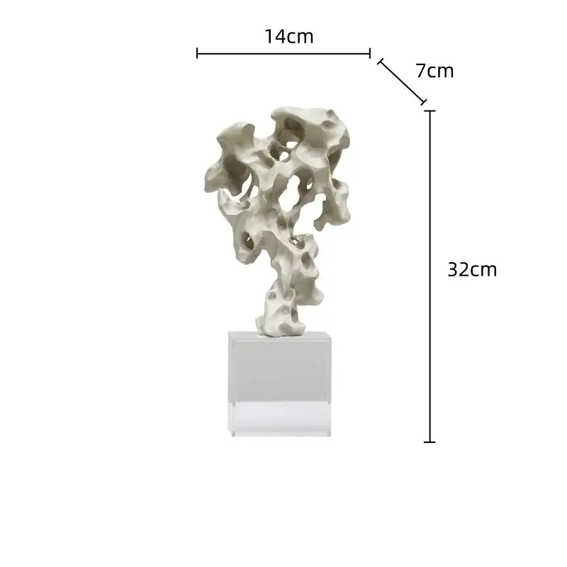 A sleek off-white resin taihu stone coral sculpture with organic contours on a clear base for living room decorbites green taihu