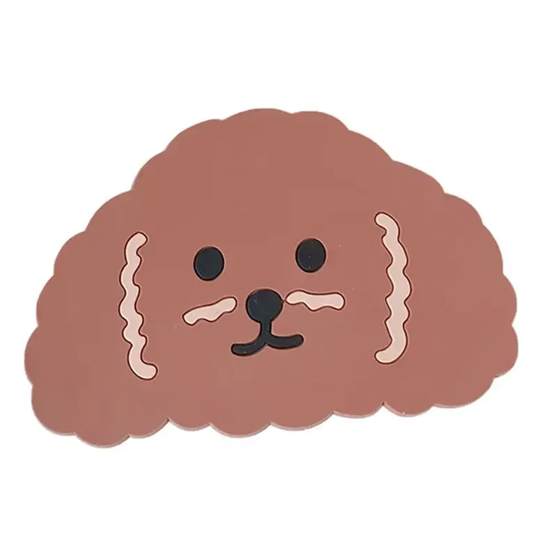 A cute brown plush dog-shaped coaster with pink whiskers from a natural lace bamboo woven coasters storage basket set