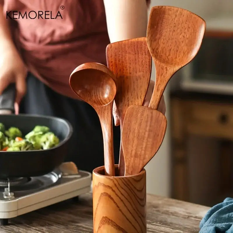 Natural polished 4-piece wooden kitchen utensil set with warm brown tones in a matching wooden holder