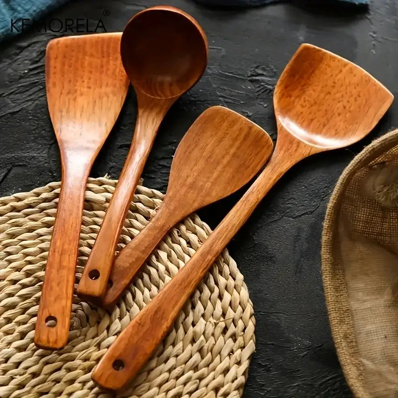 Natural polished 4-piece wooden kitchen utensil set with smooth ergonomic handles and polished surfaces