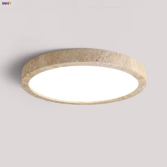 Natural travertine ellipse stone led ceiling light with a textured beige frame and bright white center for bedroom decorbites ellipse stone decor