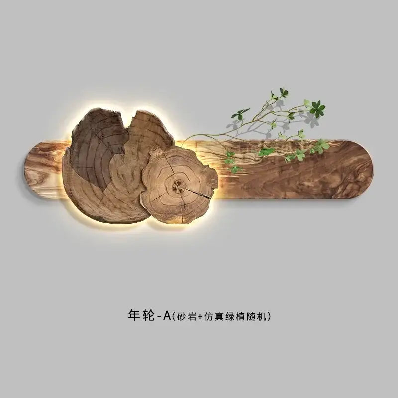 Warm-toned natural wood bedroom wall lamp with tree ring patterns and embedded faux greenery for sofa set decor