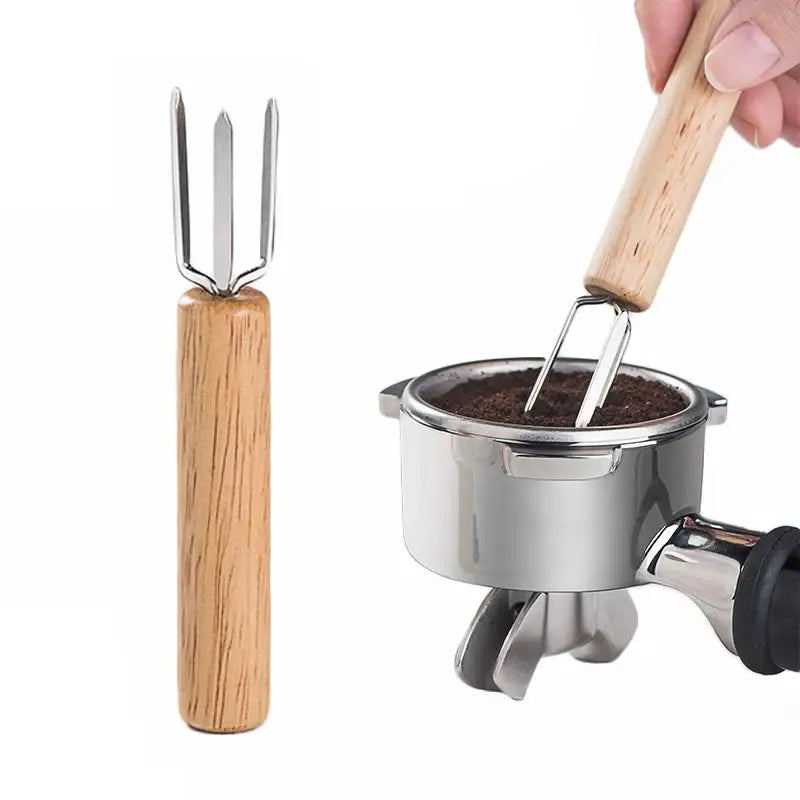 Wooden-handled decorbites espresso stirrer with a natural wood three-pronged metal head for barista use