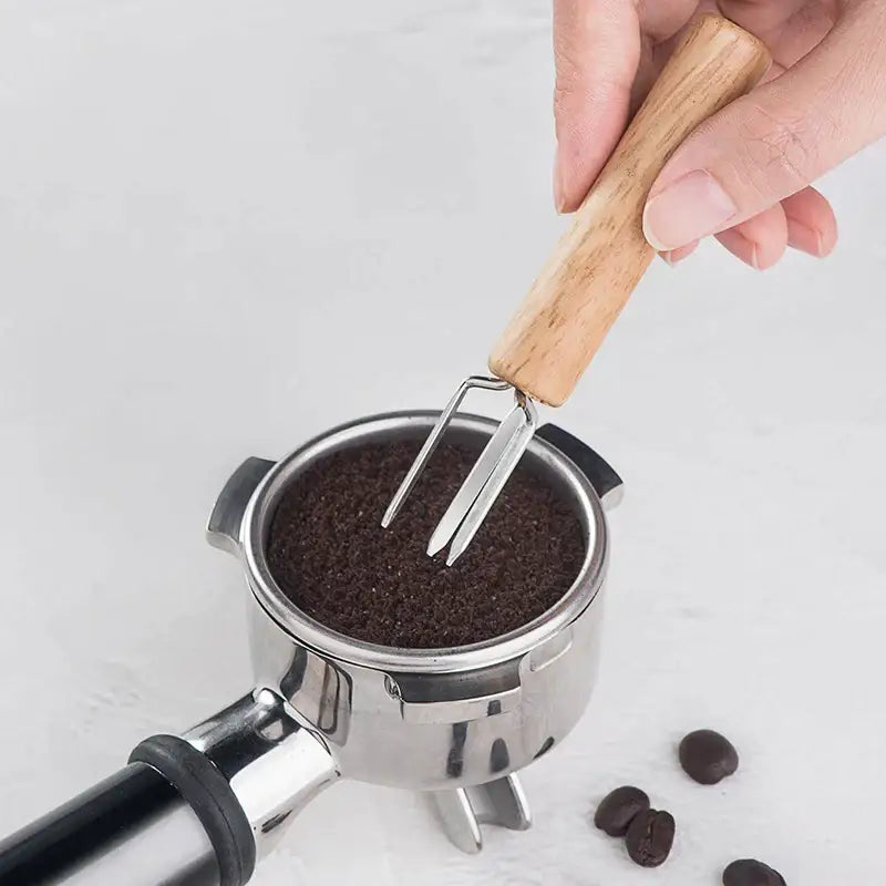 Natural wood three prong espresso stirrer with wooden handle and stainless steel fork end for decorbites espresso use