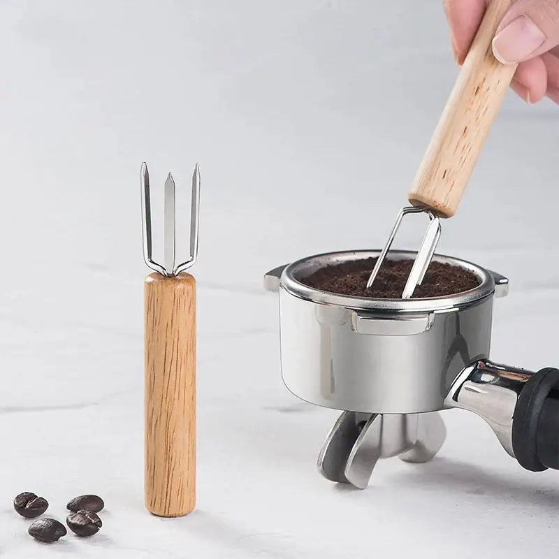 Natural wood three prong espresso stirrer with wooden handle and stainless steel head for decorbites espresso stirrer use
