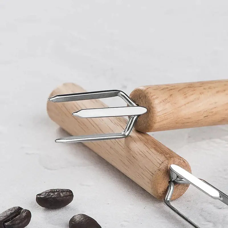 Natural wood three prong espresso stirrer with wooden handle and polished stainless steel fork head for decorbites espresso stirrer