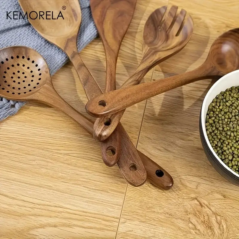 Set of five natural wooden kitchen utensils with varying designs in dark brown finish from wooden tableware set