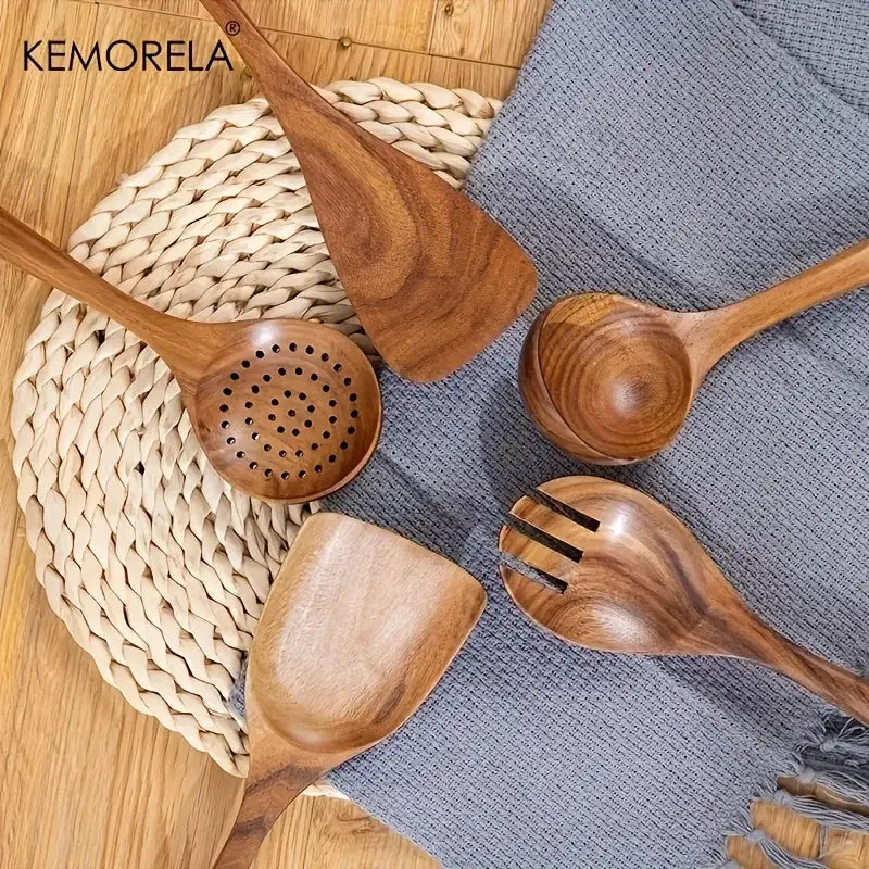 Set of four natural wooden tableware utensils with smooth polished surfaces and distinctively shaped handles
