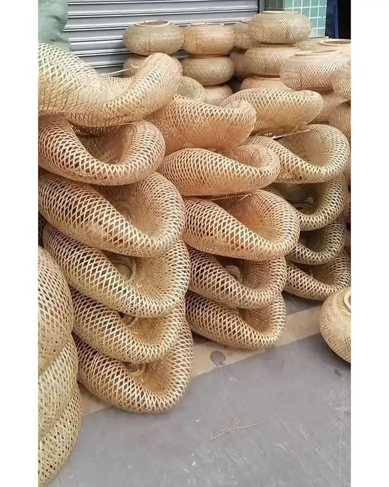 Handwoven natural bamboo pendant light with a twisted ring shape and open lattice design for dining room decorbites bamboo pendant
