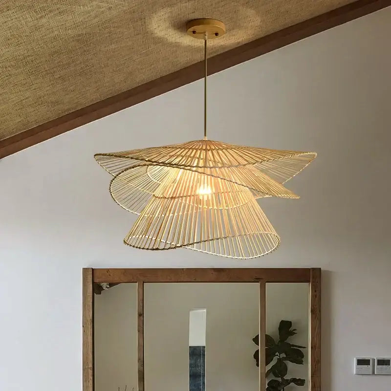 Warm-toned natural woven bamboo rattan pendant light with layered design and brass fixture for dining room decorbites bamboo rattan