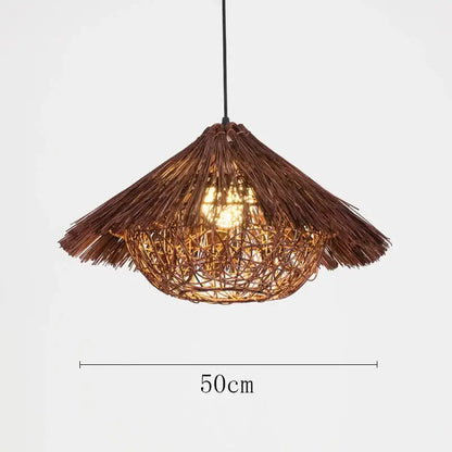 Natural woven brown rattan pendant light with a thatched conical shade and intricate lattice design for dining rooms