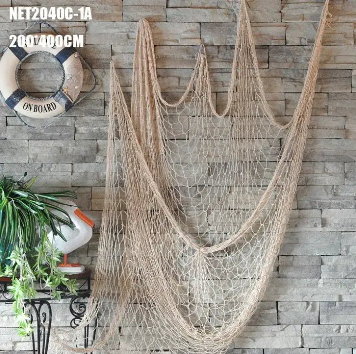Beige decorative fishing net wall hanging with woven mesh design made of natural fiber for nautical bedroom decor