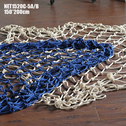 Nautical deep blue and cream decorative fishing net with woven diamond pattern for bedroom decor with seashells
