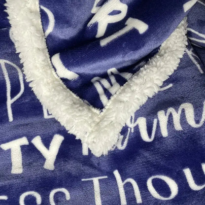 Navy and cream decorbites cozy printed flannel blanket with white cursive lettering and sherpa-lined v-neck collar