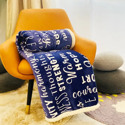 A plush navy and cream decorbites cozy printed flannel blanket with motivational words and soft sherpa trim
