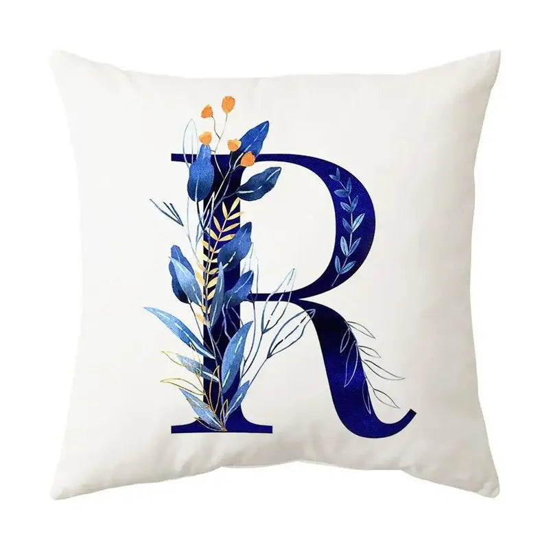 White throw pillow with navy blue alphabet flower letter r featuring decorbites blue alphabet design for bedroom decor