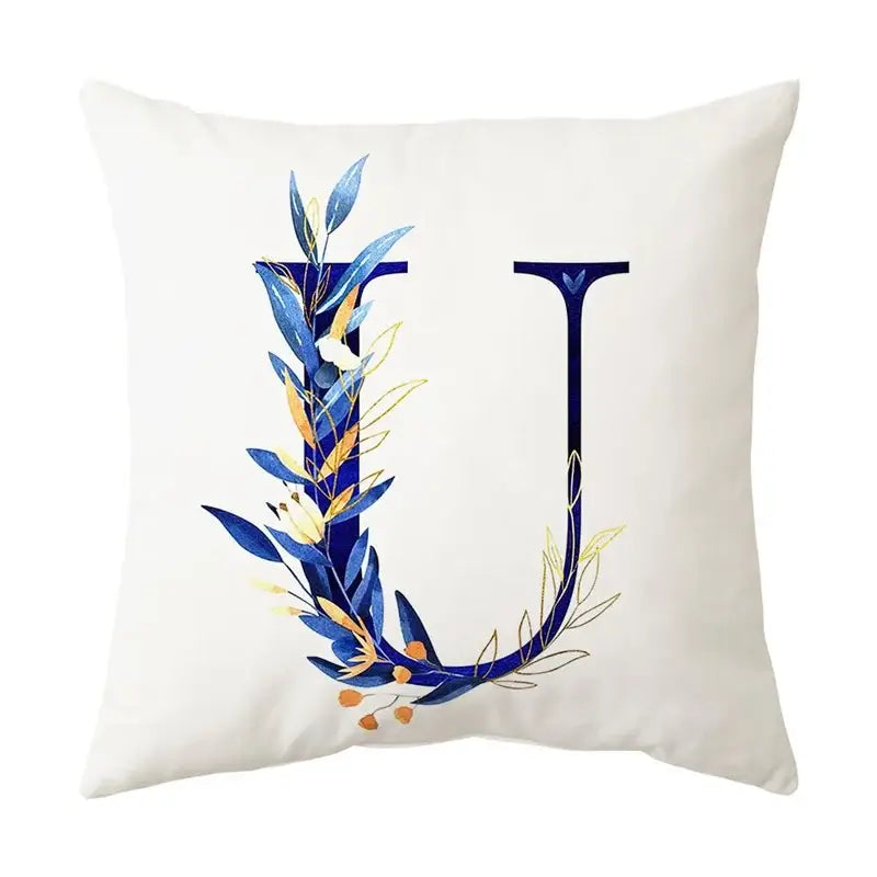 White throw pillow featuring a decorative blue alphabet flower letter u with gold foliage for bedroom decorbites decorbites blue alphabet