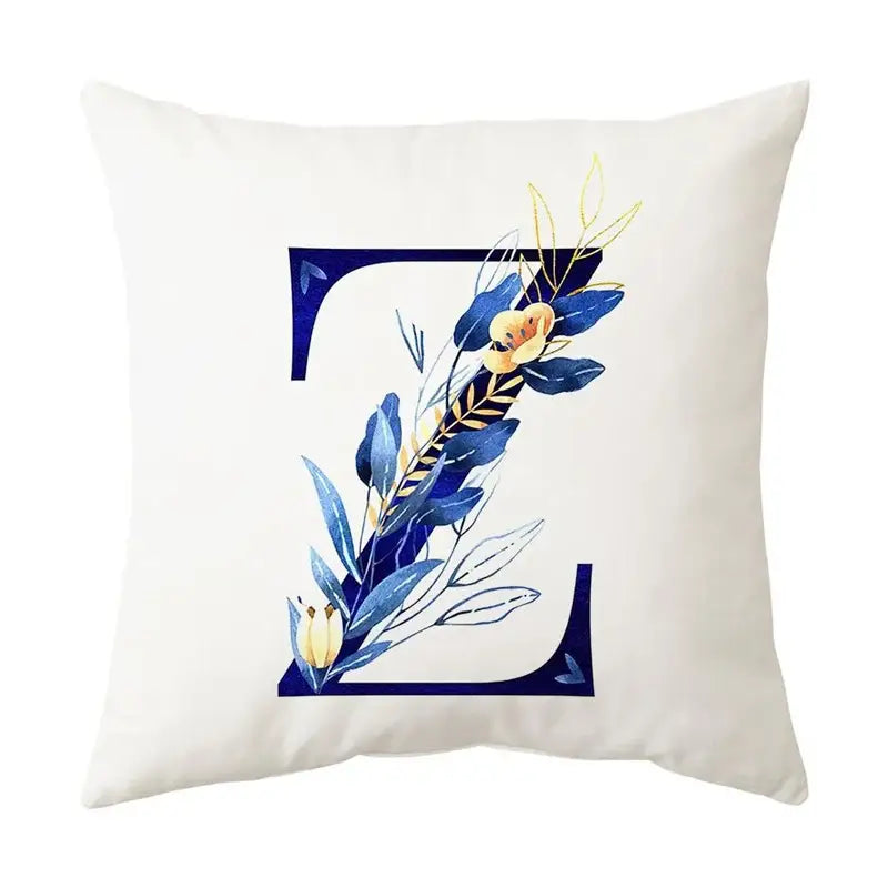 White throw pillow with navy and gold alphabet flower letter z featuring delicate blue alphabet flower decorbites design