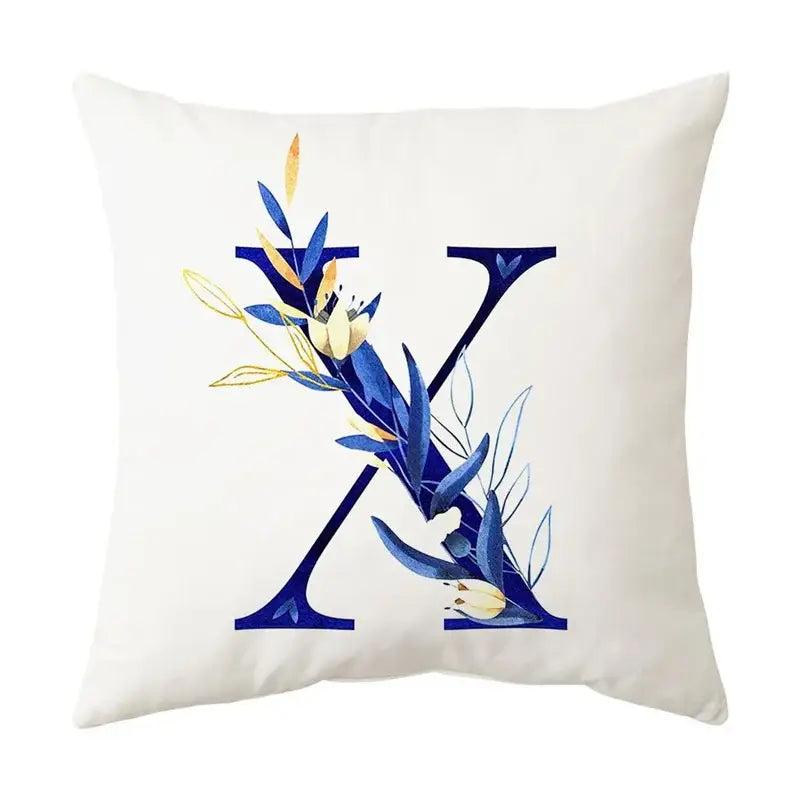 White throw pillow with navy and gold alphabet flower letter x featuring decorbites blue alphabet design for bedroom decor
