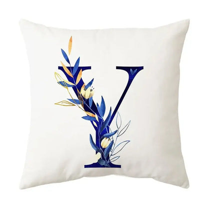 White throw pillow featuring navy and gold alphabet flower letter y with decorbites blue alphabet foliage design for decor