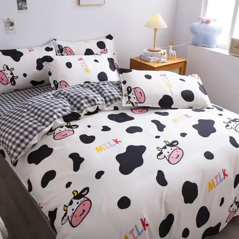 White bedding set with black cow spots and pink cute cartoon printed cows featuring milk text for bedroom use