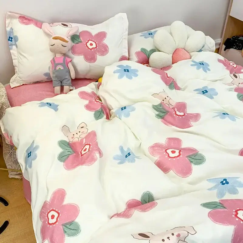 Cute cartoon printed bedding set with navy blue and white daisy patterns and plush bunny characters on white background