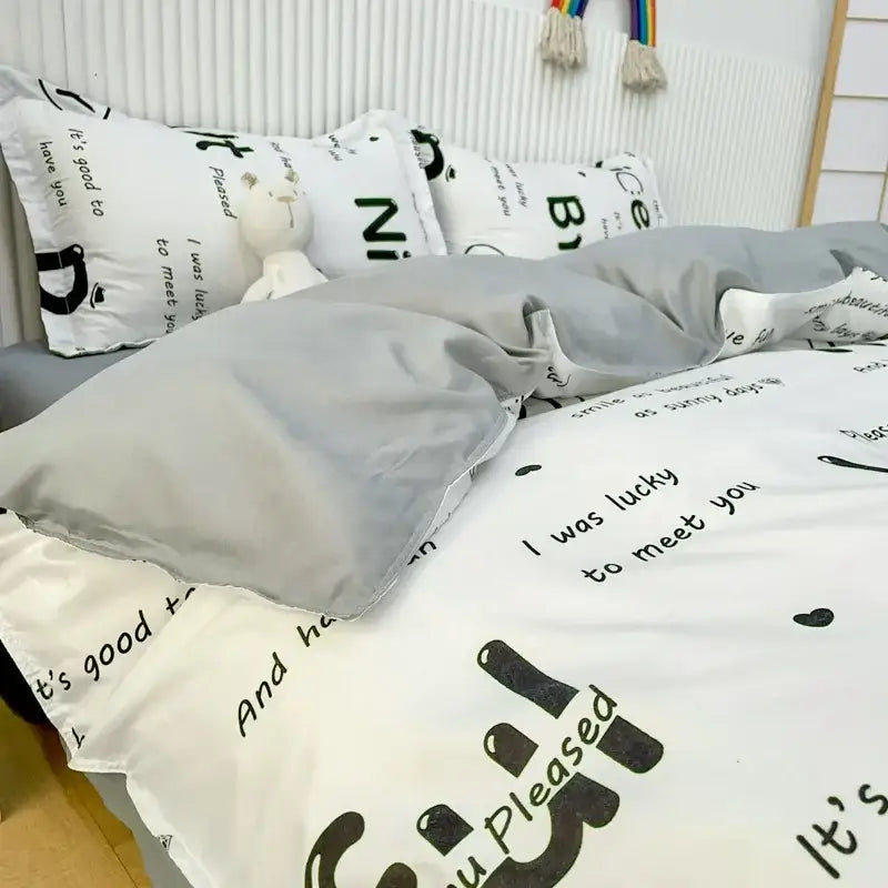 White duvet cover with black playful text in soft cotton fabric as part of a cute cartoon printed bedding set
