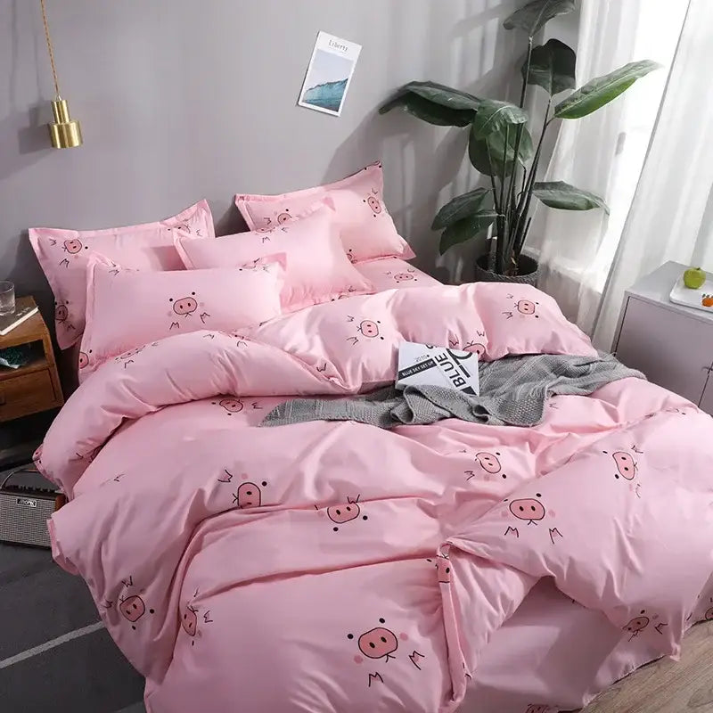 Pink pig-themed satin bedding set with cute cartoon printed pig faces on duvet cover pillows in navy blue room