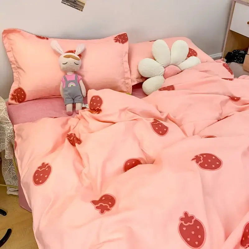Pink strawberry-patterned bedding set with soft plush fabric complementing cute cartoon printed navy blue and white daisy bedding