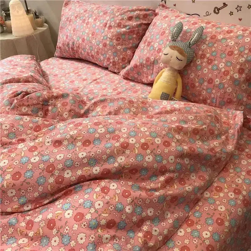 Pink floral bedding set with soft cotton texture and delicate pastel flowers for cute cartoon printed bedding use