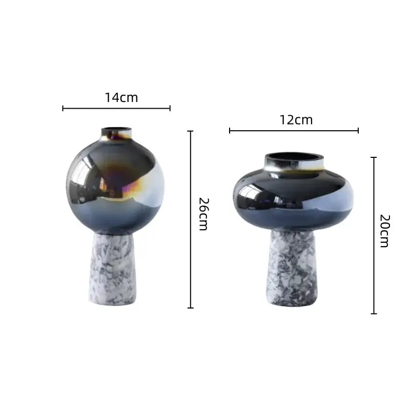 Two modern glass vases with iridescent navy blue geometric circle star finishes on white marble bases for living room decor