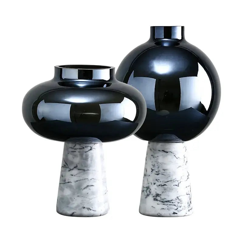 Two glossy black glass vases with marble bases featuring geometric circle star design for living room decor