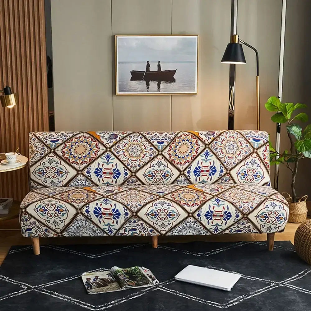 A cozy sofa with a decorbites bohemian mandala sofa cover in navy blue gold featuring geometric floral designs