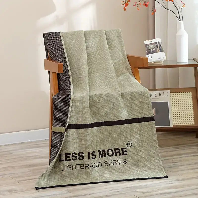 Beige linen throw blanket with black border and less is more text paired with navy blue gold hibiscus cat bath towel decorbites cat bath accessory