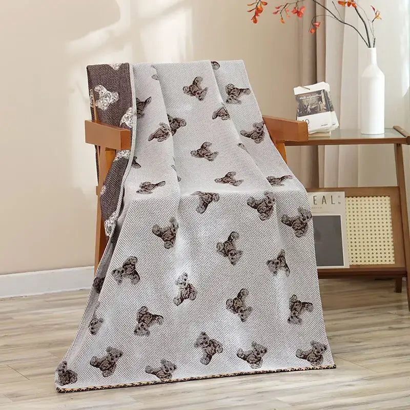 A soft light gray cotton gauze bath towel with small brown teddy bears featuring navy blue gold hibiscus cat bath decorbites design