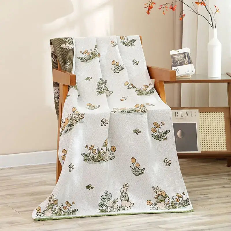A soft white bath towel with charming rabbits and mushrooms pattern in earthy tones for decorbites cat bath use