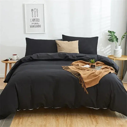 Black solid color decorbites cotton 4pcs bedding set with white trim and beige accent pillow for bedroom use