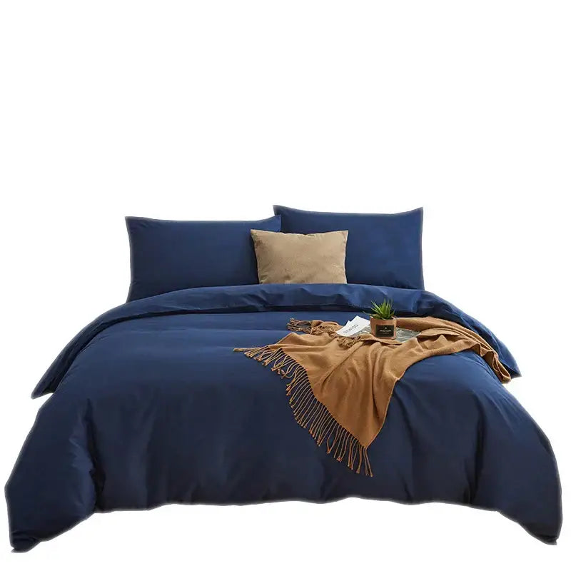 Navy blue solid color decorbites cotton 4pcs bedding set with satin finish and tan throw blanket accents